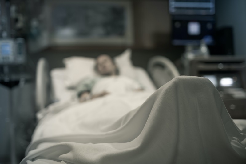 Woman lying in hospital bed (Getty Images)