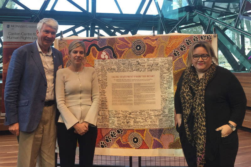 Frank Brennan with co-panellists Kristen Hilton, Victorian Equal Opportunity and Human Rights Commissioner, and Megan Davis, Member of the UN Expert Mechanism on Rights of Indigenous Peoples, in front of the Uluru Statement.
