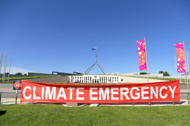 Protestors at an Anti Adani protest in front of Parliament House on 12 February 2019. (Photo by Tracey Nearmy/Getty Images)