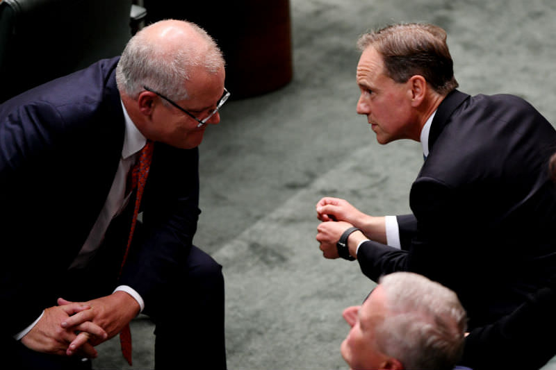 Prime Minister Scott Morrison speaks to Health Minister Greg Hunt during Question Time in Canberra on 4 April 2019. (Photo by Tracey Nearmy/Getty Images)