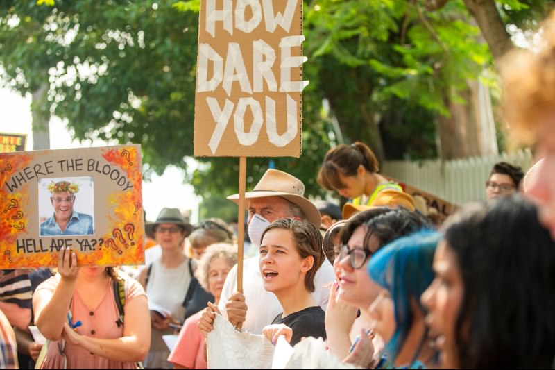 Protestors hold up banners during a protest at Kirribilli House in Sydney on 19 December 2019. Protestors organised the rally outside Prime Minister Scott Morrison's Sydney residence over his absence during the ongoing bushfire emergencies across Australia. (Photo by Jenny Evans/Getty Images)