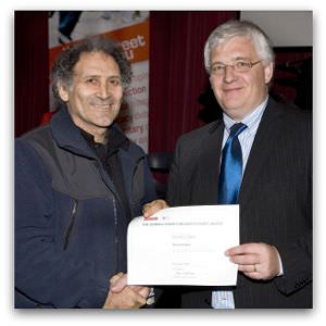 Arnold Zable, highly commended in the inaugural Eureka Street/Reader's Feast Award, receives his award from Brendan Kilty