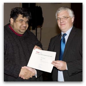 Irfan Yusuf, highly commended in the inaugural Eureka Street/Reader's Feast Award, receives his award from Brendan Kilty