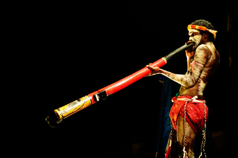 Aboriginal man playing didgeridoo