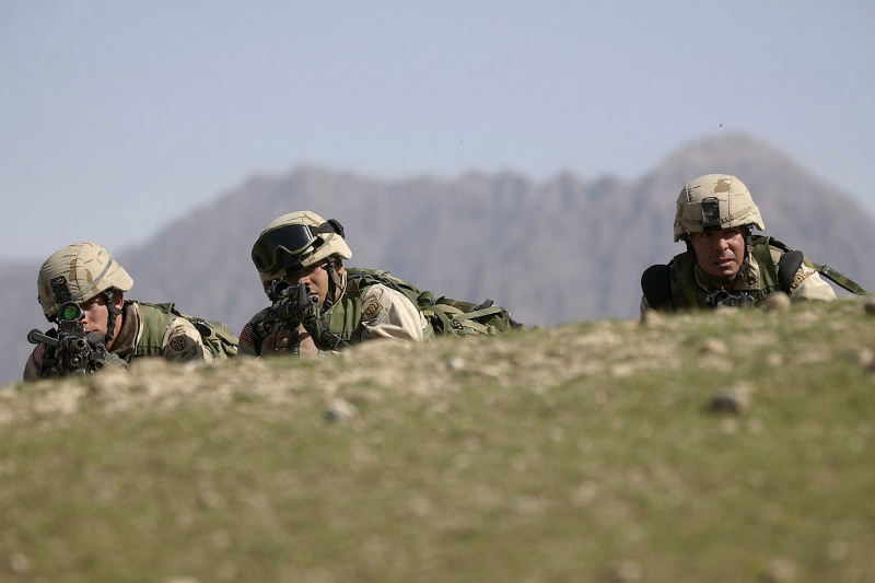 US soldiers from the 82nd Airborne cover a ridge during 'Operation Viper', 19 February 2003 in the Baghran Valley, Afghanistan. 'Operation Viper' was an operation to search from village to village for weapons and signs of Taliban and al-Qaeda sympathisers. (David Swanson-Pool/Getty Images)