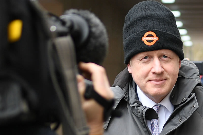 Boris Johnson wearing a beanie and facing a TV camera in March 2019. (Photo by Leon Neal/Getty Images)