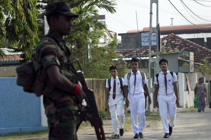 A security officer stands alert as students return to school following the reopening of schools across Sri Lanka on 6 May, in the wake of the Easter attacks. (Photo by Allison Joyce/Getty Images)