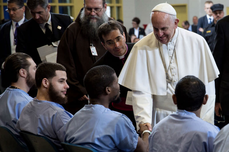 Pope Francis visits with inmates during his visit to the Curran-Fromhold Correction Facility in Philadelphia, Pennsylvania, on 27 September 2015. (Photo by Todd Heisler-Pool/Getty Images)