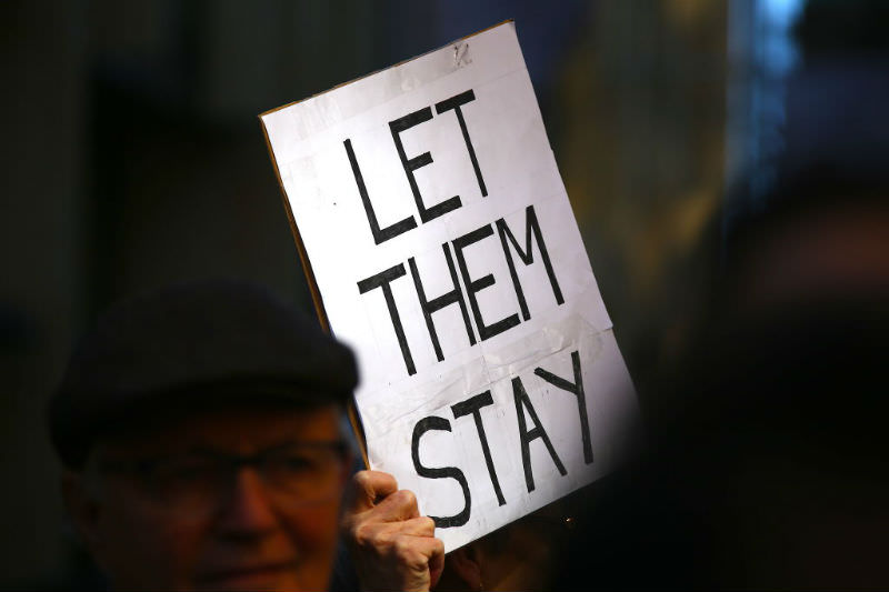 Sign reading 'Let them stay' at 2019 rally against deportation of Tamil family (Getty Images/David Gray)
