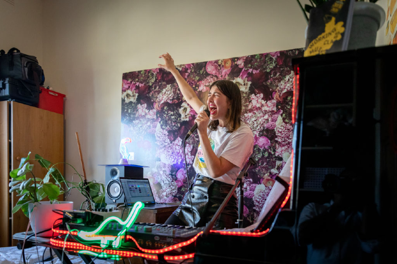 Gina Somfleth one half of musical group Peachnoise performs at her home as part of Isol-Aid on March 28, 2020 in Melbourne, Australia. (Asanka Ratnayake/Getty Images) 