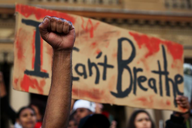 Main image: Raised fist at protest (Lisa Maree Williams/Getty Images)