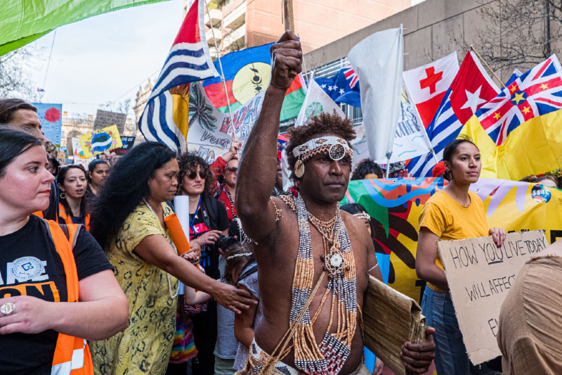 Main image:  A man wearing the traditional dress of the Solomon Islands march on September 20, 2019 in Melbourne, Australia. (Photo by Asanka Ratnayake/Getty Images)