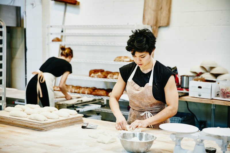 Main image: Baker shaping dough (Thomas Barwick/Getty Images)