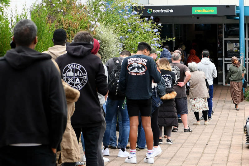 Main image: People lining outside Centrelink in Melbourne (Getty Images/Quinn Rooney)