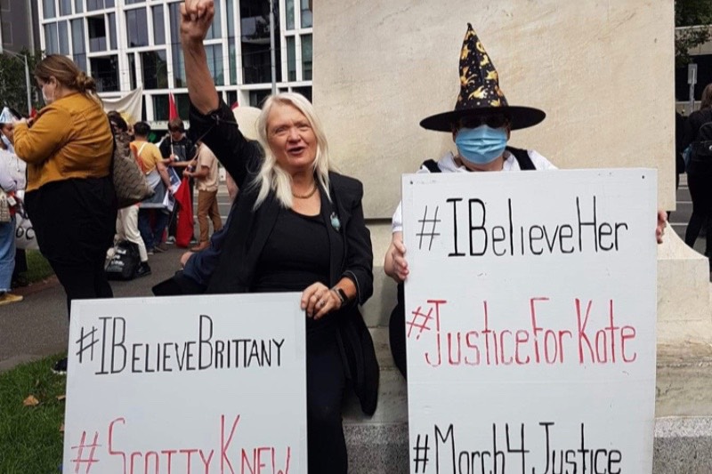 Image: Protestors, Helen and Julie, with signs reading 'March4Justice, JusticeforKate, IBelieveHer, IBelieveBrittany, ScottyKnew' (Supplied)