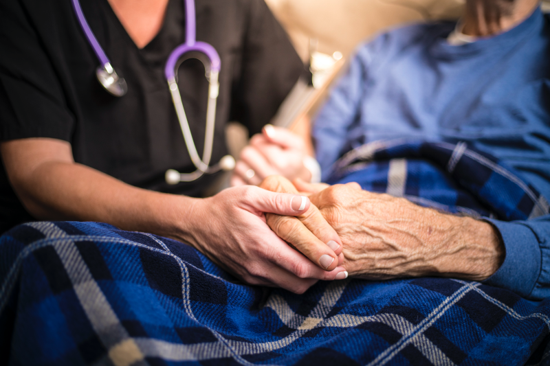 Main image: Nurse holding patient's hand (Getty Images)