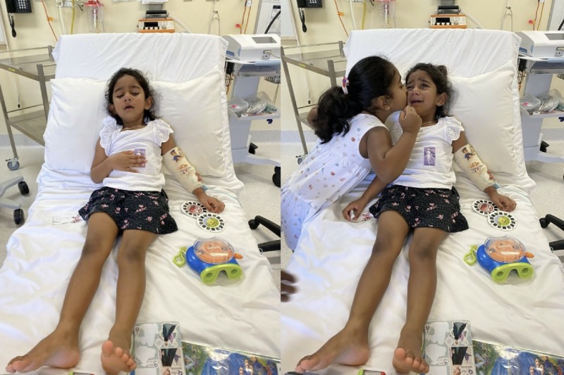 Main image: Tharnicaa Murugappan in a hospital bed with her sister Kopika (Supplied/AAP) 