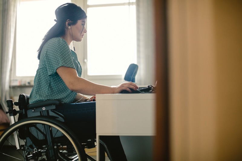 Main image: Woman using a wheelchair to sit at home office (Getty Images)