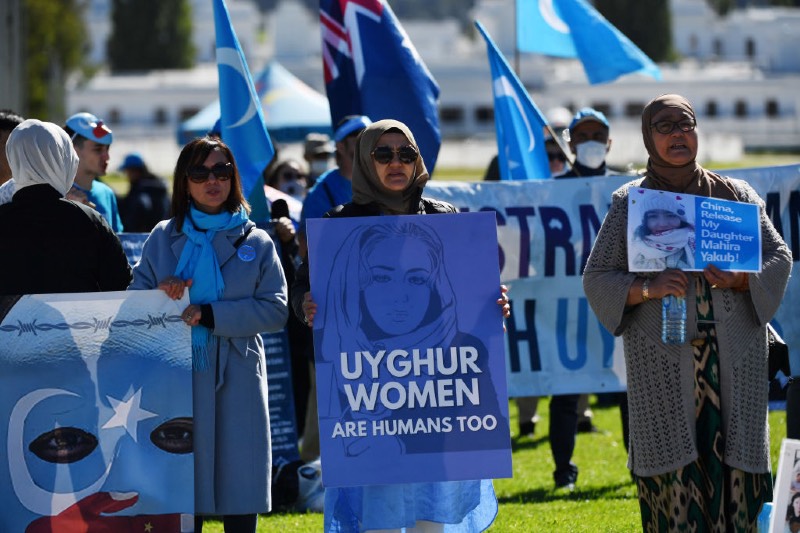 Main image: Protestors attend a rally for the Uyghur community at Parliament House on March 15, 2021 in Canberra, Australia as part of March4Justice against gendered violence (Sam Mooy/Getty Images)