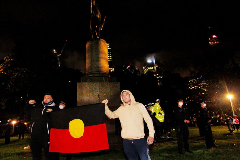 Protestors outside Captain Cook statue (Lisa Maree Williams/Getty Images)