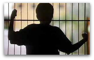 Kid behind bars