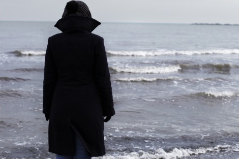 Lonely person on a beach in winter time Lonely person on a beach in winter time