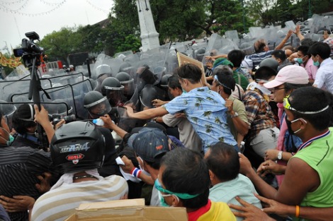 Nationalist anti-government protesters from Pitak Siam clash with riot police at a rally on Makhawan Bridge on Nov 24, 2012 in Bangkok, Thailand.
