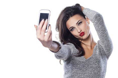 Young woman taking selfie