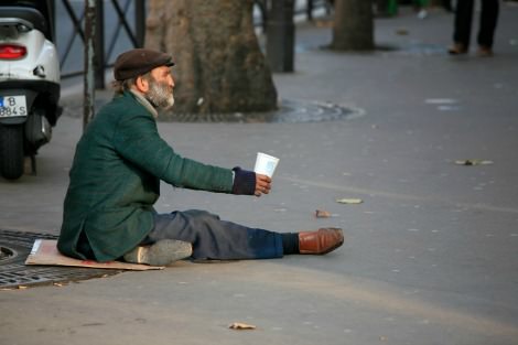 Homeless man begging. Image by  Alex Proimos / WikiCommons