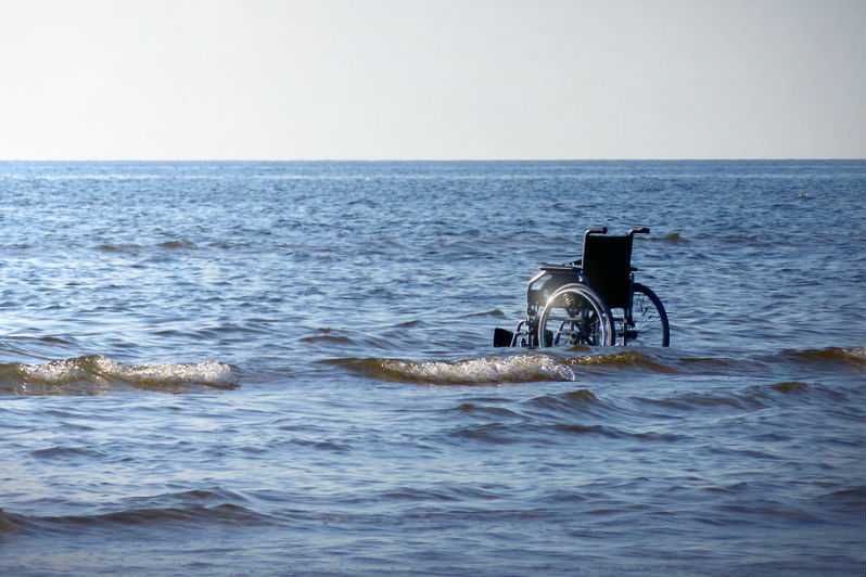 Wheelchair in ocean