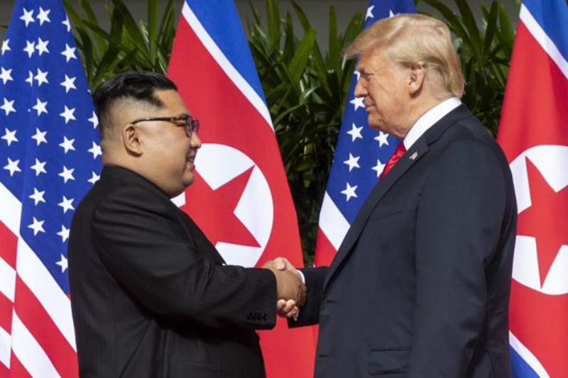 Kim Jong-un greets Donald Trump