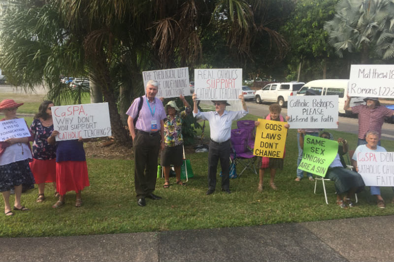 Frank Brennan with the protesters outside the venue