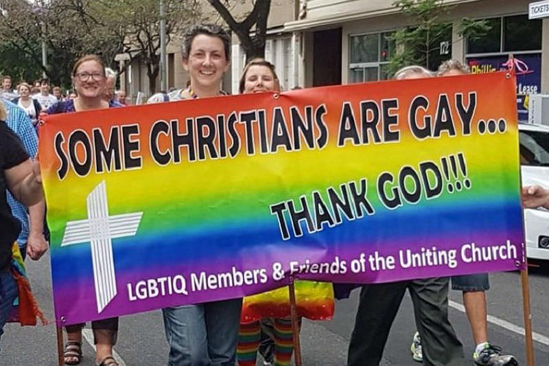 LGBTIQ Members and Friends of the Uniting Church banner reads 'Some Christians are gay ... thank god!'
