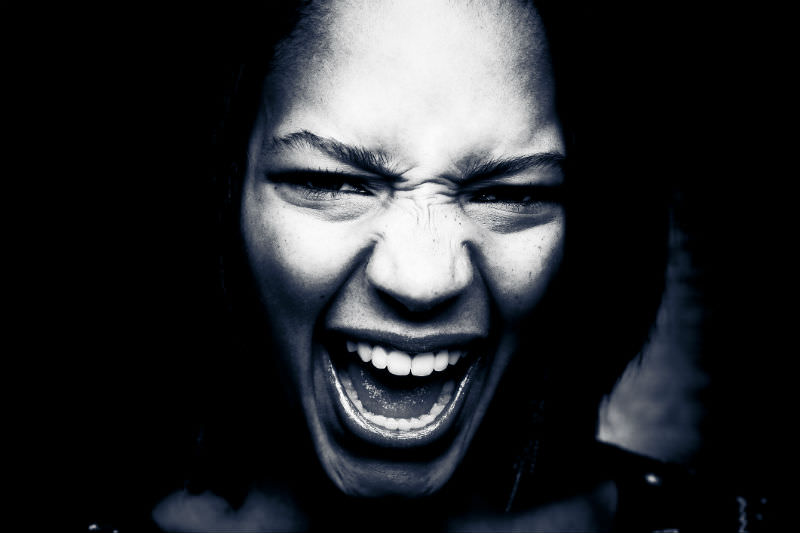 Young woman screaming. FuzzMartin/Getty