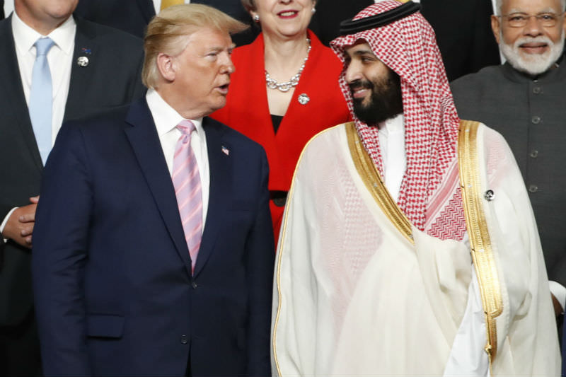 US President Donald Trump speaks with Saudi Arabia's Crown Prince Mohammed bin Salman during a family photo session at the G20 summit on 28 June 2019 in Osaka, Japan. (Photo by Kim Kyung-Hoon - Pool/Getty Images)