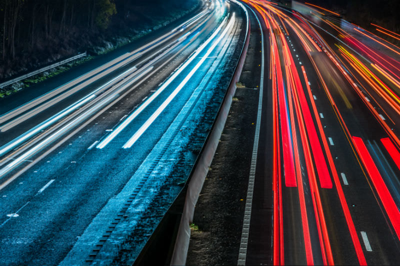 Fast cars on motorway (photo by yevtony via Getty)