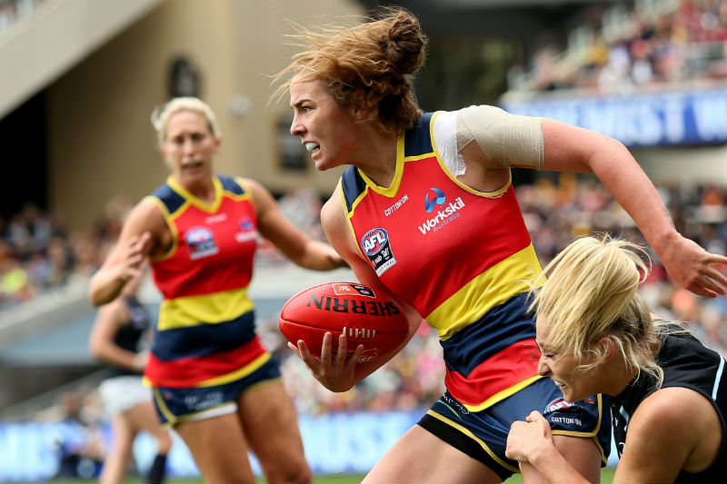 Sarah Hosking of the Carlton Blues tackles Jenna McCormick of the Adelaide Crows during the 2019 AFLW Grand Final at Adelaide Oval in March 2019. (Photo by James Elsby/AFL Photos/Getty Images)