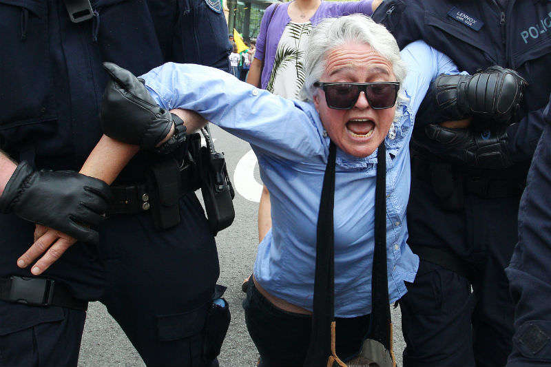 A woman is arrested by police during the Extinction Rebellion protest in Sydney on 7 October 2019 in Sydney, Australia. (Photo by Lisa Maree Williams/Getty Images)