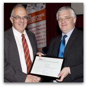 Tony Kevin, winner of the inaugural Eureka Street/Reader's Feast Award, receives his award from Brendan Kilty